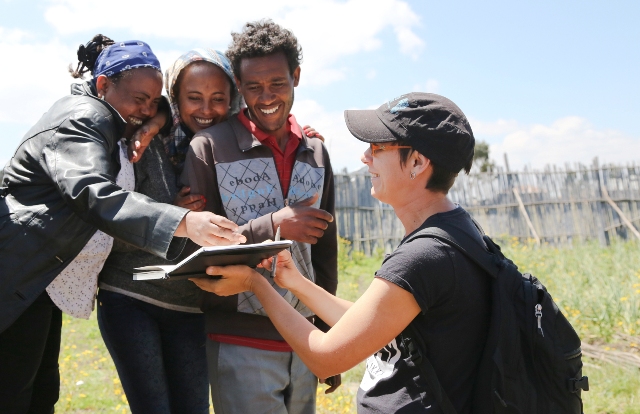 ADHENO's community workers seeing the croquis of themselves. 